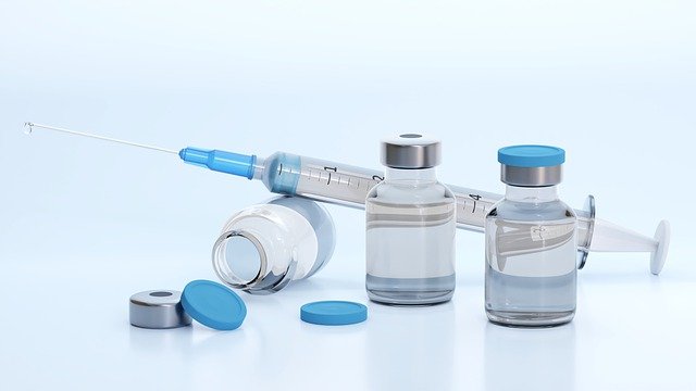 A medical vial and syringe.